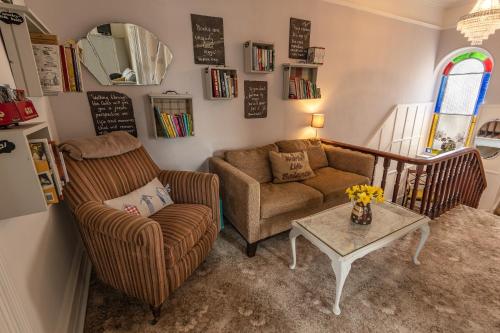 a living room with a couch and a table at Craiglands Bed and Breakfast, Grassington in Grassington