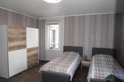 Postel nebo postele na pokoji v ubytování Super Erdgeschosswohnung