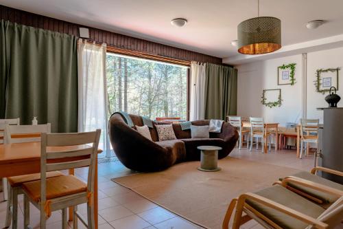 a living room with a couch and a table at TUBA Apartments in Bohinj