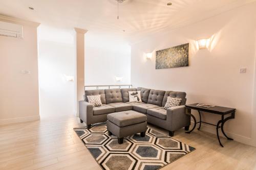 a living room with a couch and a table at Bay Gardens Beach Resort & Spa in Gros Islet