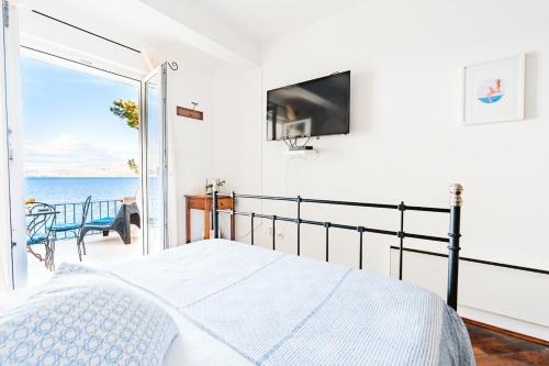 Postel nebo postele na pokoji v ubytování Sutivan Best Apartments