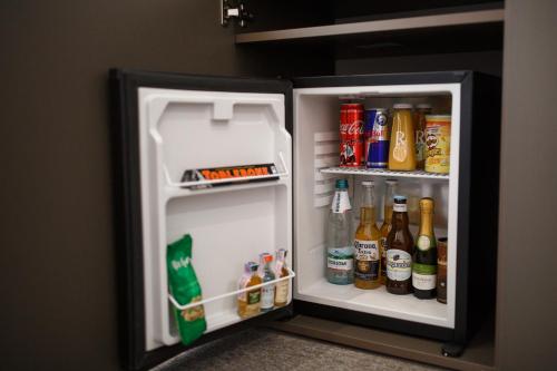 an open refrigerator filled with drinks and drinks at Kulikovskiy hotel in Kharkiv