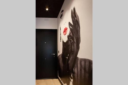 a wall with a painting of a demon on it at LOFT MON in Zaragoza