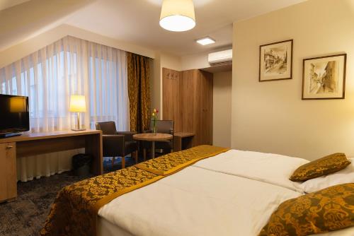 Postel nebo postele na pokoji v ubytování Hotel Olesno