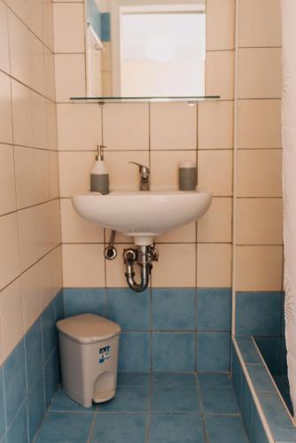 a bathroom with a sink and a toilet at Best House, Nirvana II, Patra in Patra