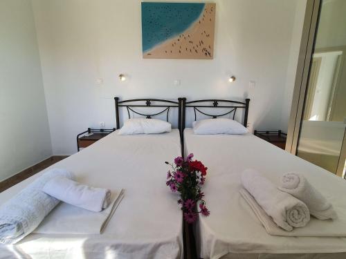 Ένα ή περισσότερα κρεβάτια σε δωμάτιο στο Tasos Rooms