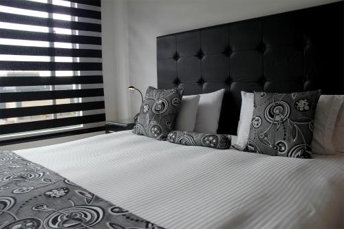 Cama o camas de una habitación en Hotel Santafe Real