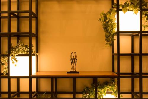 a shelf with a trophy on top of it at Parasol Luxury Hotel & Suites Adults Only in Karpathos Town