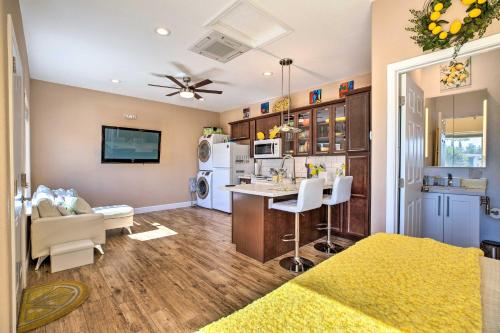 a living room with a kitchen and a dining room at Modern Sun City Studio Near Deer Valley Golf in Sun City West
