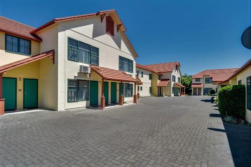 a row of houses on a street at Cumberland Court Motel in Hastings