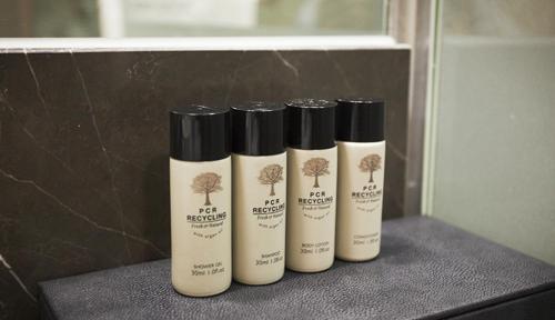 three bottles of hair products sitting on a counter at ON City Hotel in Cheonan