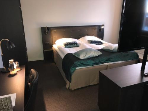 Postel nebo postele na pokoji v ubytování Hotell Valhall