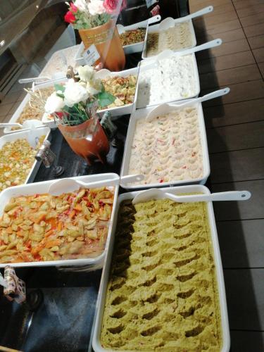 a buffet with many trays of food on a table at Iris Hotel & Spa in Canakkale