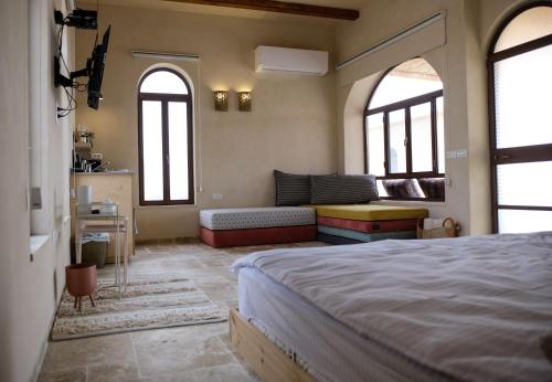 Ένα ή περισσότερα κρεβάτια σε δωμάτιο στο Incense and Spice Route Inn