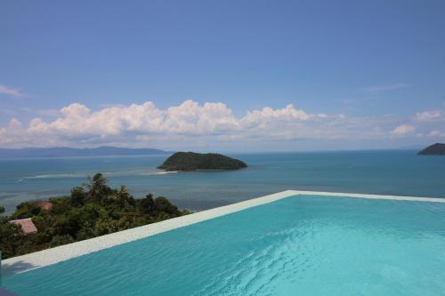 a swimming pool with a view of the ocean at Bluerama - Adults Only in Haad Pleayleam