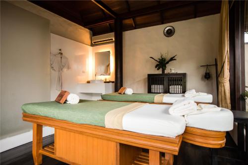 Una cama o camas en una habitación de Kirimaya Golf Resort Spa - SHA Plus Certified
