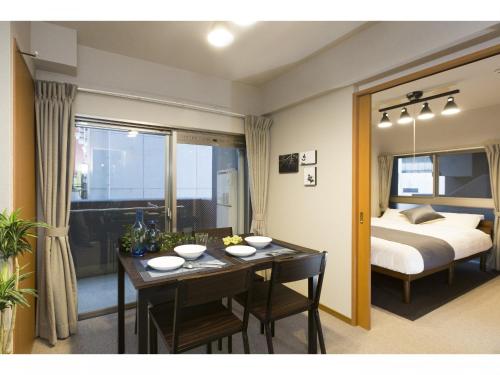 Postel nebo postele na pokoji v ubytování Coruscant Hotel Nagasakieki