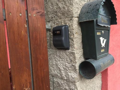 a pay meter on the side of a wall at Dům Stašov in Stašov