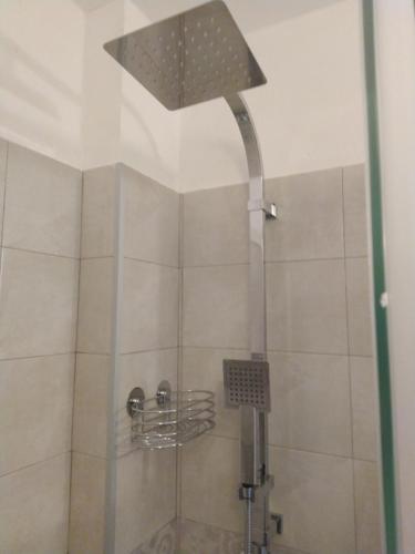 a bathroom with a shower stall and a shower curtain at Hotel Centrale Europa in Catania