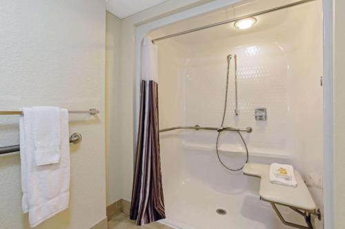 a bathroom with a shower and a sink at La Quinta by Wyndham Boston Somerville in Somerville