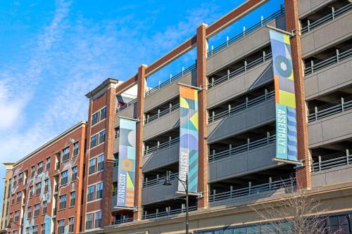 a building with colorful banners on the side of it at La Quinta by Wyndham Boston Somerville in Somerville