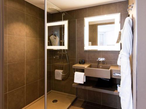 Ein Badezimmer in der Unterkunft Novotel Basel City