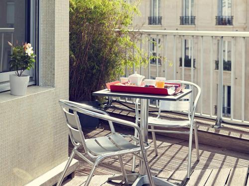 a table with a basket of food on top of it at Mercure Paris Bastille Saint Antoine in Paris