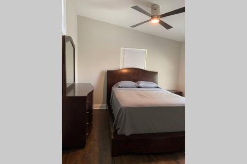 a bedroom with a bed and a ceiling fan at Modern Home:3 Bedroom;2.5 Bath Near M-Benz Stadium in Atlanta