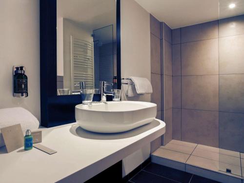 a bathroom with a sink and a shower at B&B HOME Brides-les-Bains Les 3 Vallées in Brides-les-Bains