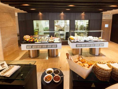 a buffet line with many different types of food at Novotel Tunis in Tunis