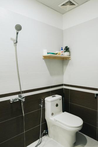 a bathroom with a toilet and a shower at ngaunhien's house - Homestay in Thôn Dư Khánh