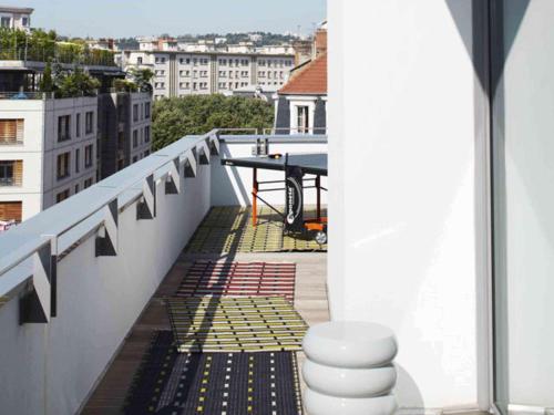 a balcony with a view of a city at Mama Shelter Lyon in Lyon