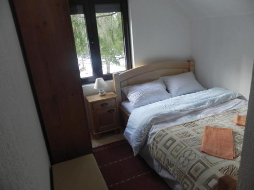 Postel nebo postele na pokoji v ubytování Apartments Vuković