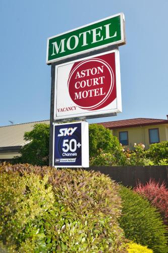 a sign for a motel with a sign for a store at Aston Court Motel in Blenheim