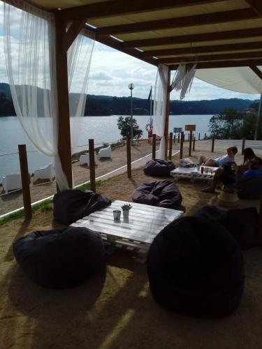 a group of people sleeping under a tent near the water at Casa do Trapo in Abrantes