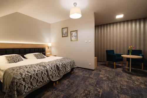 Postel nebo postele na pokoji v ubytování Hotel Olesno