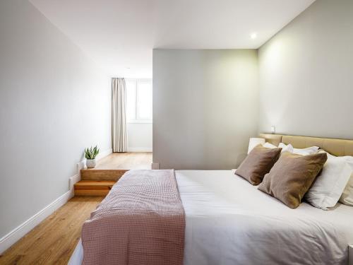 Un ou plusieurs lits dans un hébergement de l'établissement Oporto View Apartments