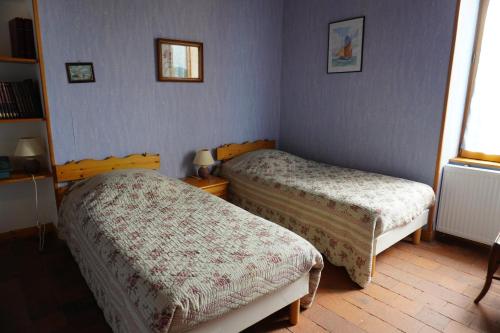 A bed or beds in a room at Gîte des Grands Narreaux