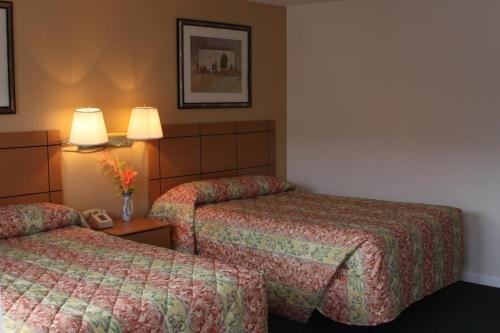 Voodi või voodid majutusasutuse New Relax Inn Bridgeview toas