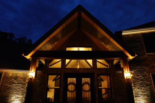 a front door of a house at night at Hidden Meadows Bed and Breakfast in Stillwater