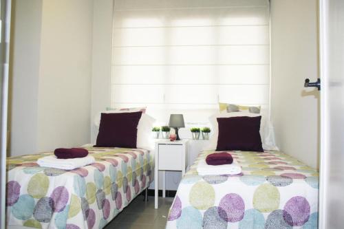 Katil atau katil-katil dalam bilik di Apartment Carrer Lepant
