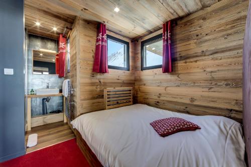 מיטה או מיטות בחדר ב-Appartement d'exception Tignes
