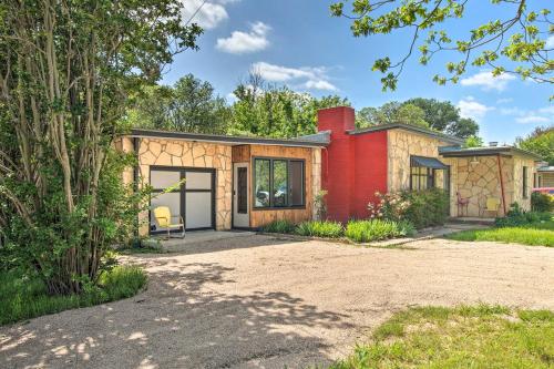 a house with a red at Retro Updated Blanco Abode - Steps to Main Street! in Blanco