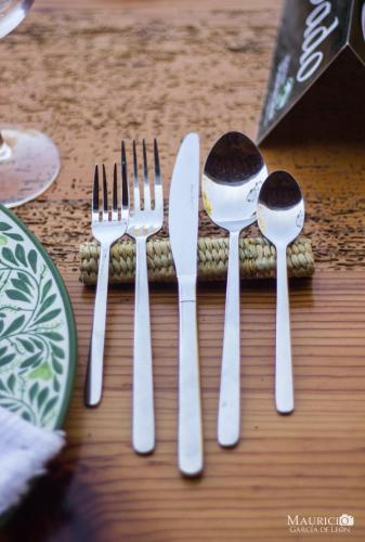 a group of forks and spoons on a table at Hacienda Ucazanaztacua in Pátzcuaro
