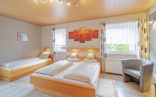 
Ein Bett oder Betten in einem Zimmer der Unterkunft Hotel Ulftaler Schenke

