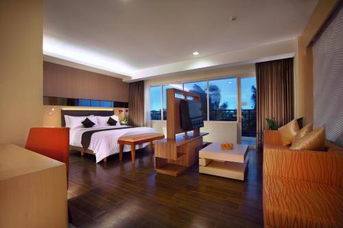 Tempat tidur dalam kamar di BW Suite Belitung