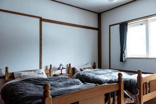 Säng eller sängar i ett rum på Lakeside HANARE