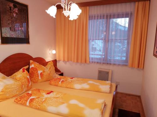 En eller flere senge i et værelse på Appartement Sonja Nassfeld