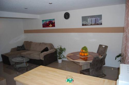 a living room with a couch and a table at Gemütliches ZUHAUSE fühlen in Singen