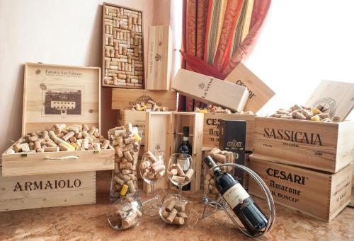 a pile of boxes with wine glasses and a wine bottle at Etrusco Arezzo Hotel - Sure Hotel Collection by Best Western in Arezzo